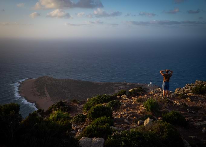 Coastal View with Person and Lighthouse