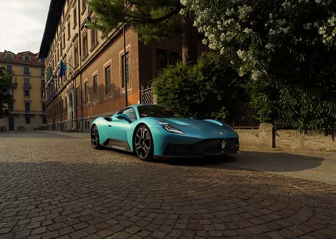Teal Maserati MC20 on Cobblestone Street