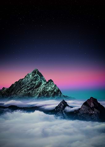 Mountains above the clouds at night