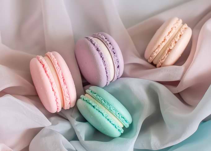 Pastel Macarons on Silky Fabric