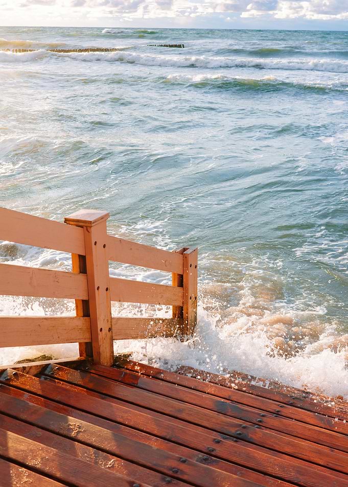 Waves Crashing on Wooden Stairs