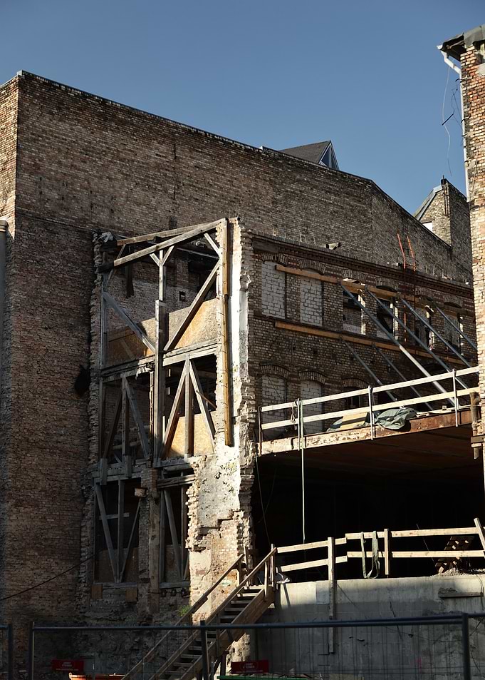 Building Under Construction with Brick Facade