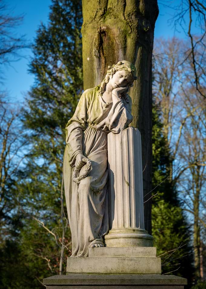 Pensive Statue in a Garden Setting