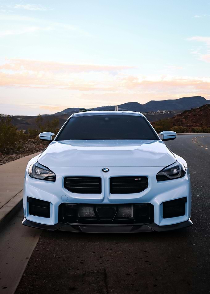 Light Blue BMW M2 on Road