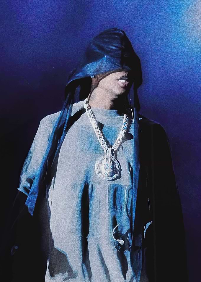 Man with covered eyes and chain