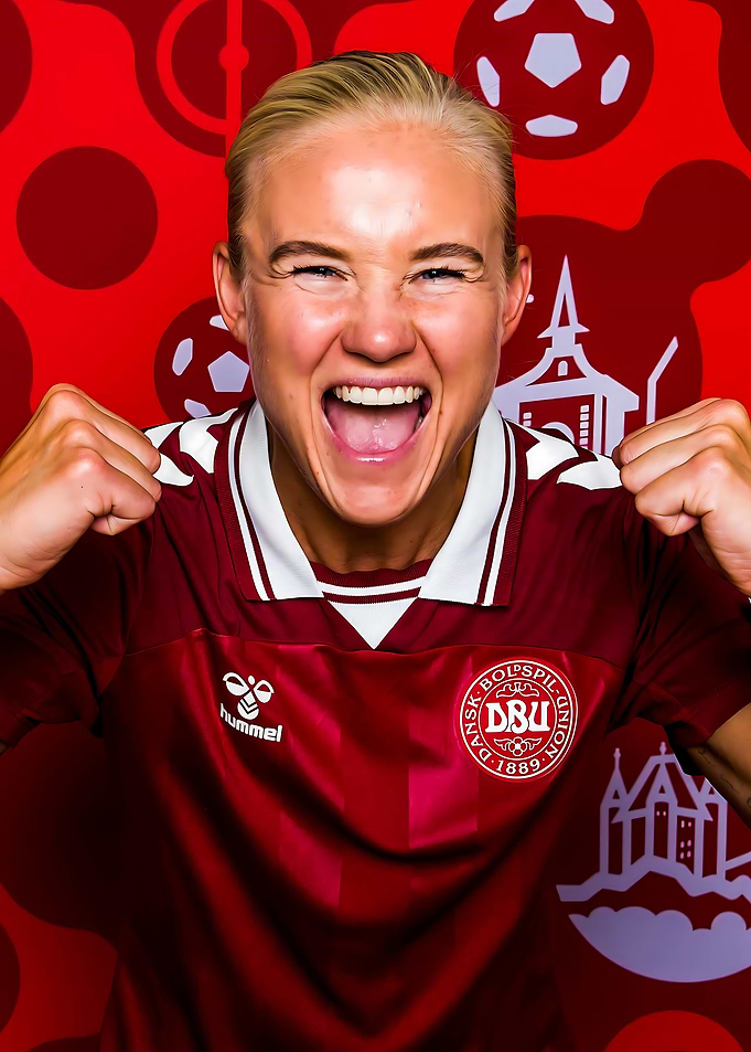 Excited Soccer Player in Denmark Jersey