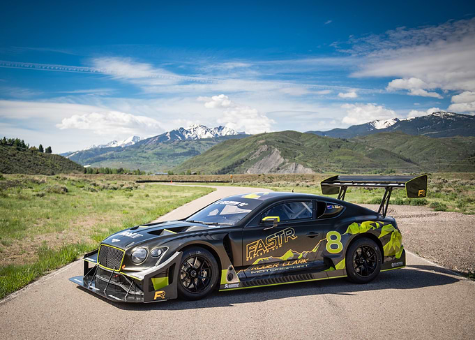 Black Race Car on Mountain Road