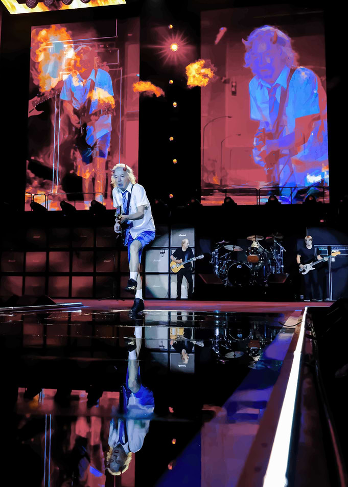 AC/DC performing live on stage