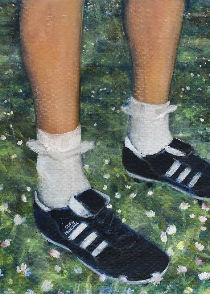 Soccer shoes in a flower field