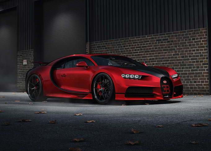 Red Bugatti Chiron parked near wall