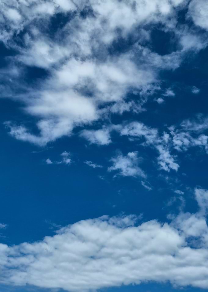 Blue Sky with White Clouds with a cumulus cloud on the bottom
