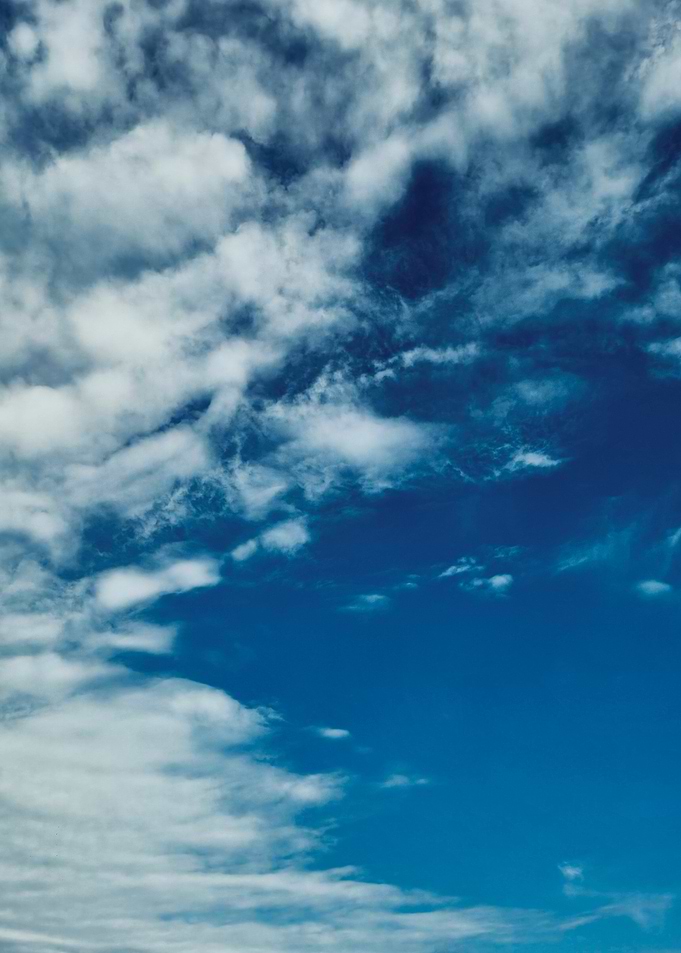 Bright Blue Sky with Wispy White Clouds