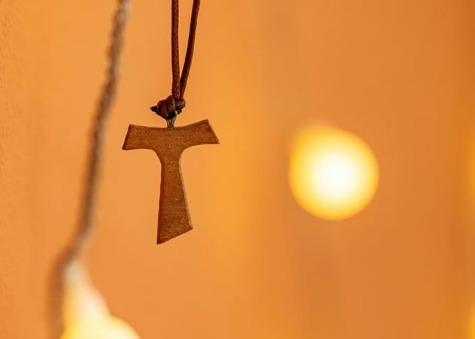 Tau Cross Pendant on Orange Background