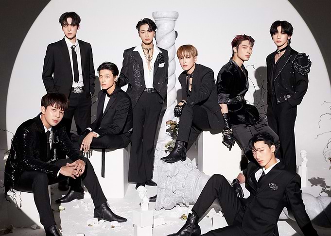 ateez group portrait in black suits