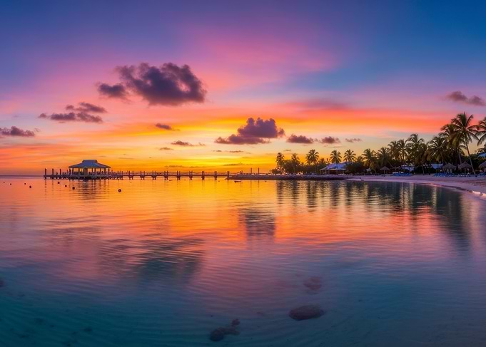 Tropical Beach Sunset with Pier