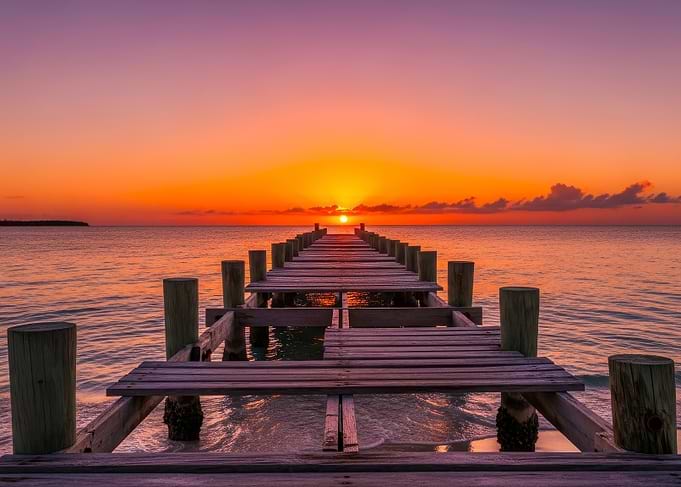 Sunset over the ocean with pier