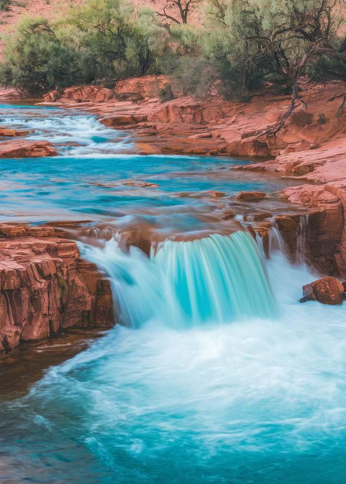 Waterfall cascading over red rock landscape
