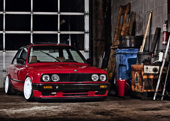 Red BMW E30 in Garage