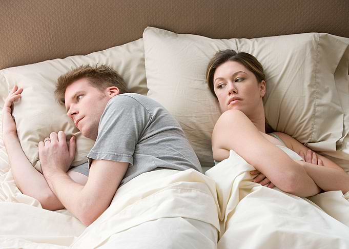 Couple in Bed with Relationship Issues