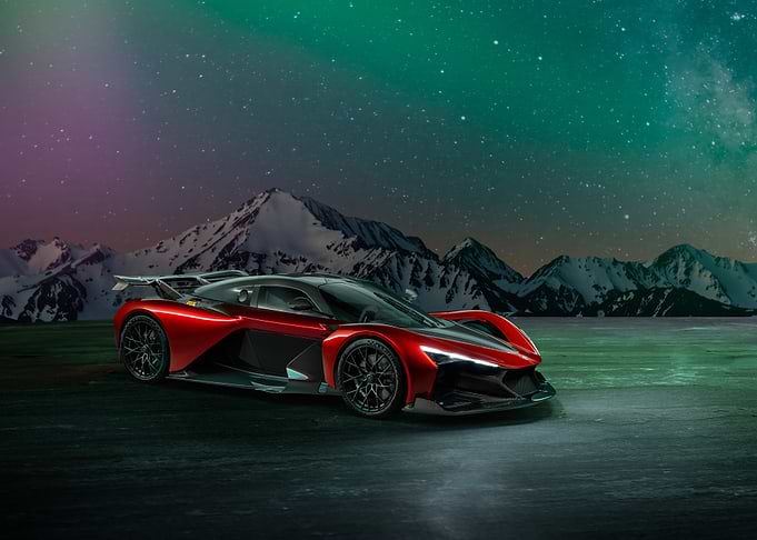 Red Sports Car Under Starry Sky