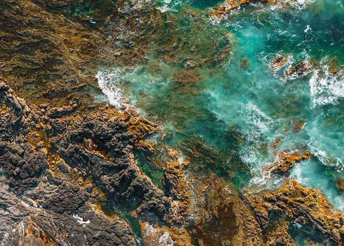 Aerial View of Rocky Coastline and Ocean