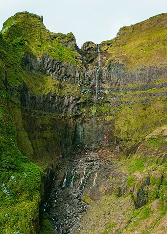 Waterfall cascading down a rocky cliff