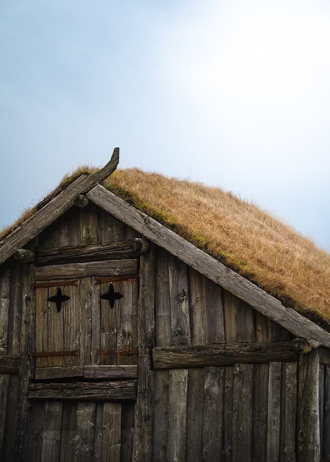 Old wooden house with grass roof