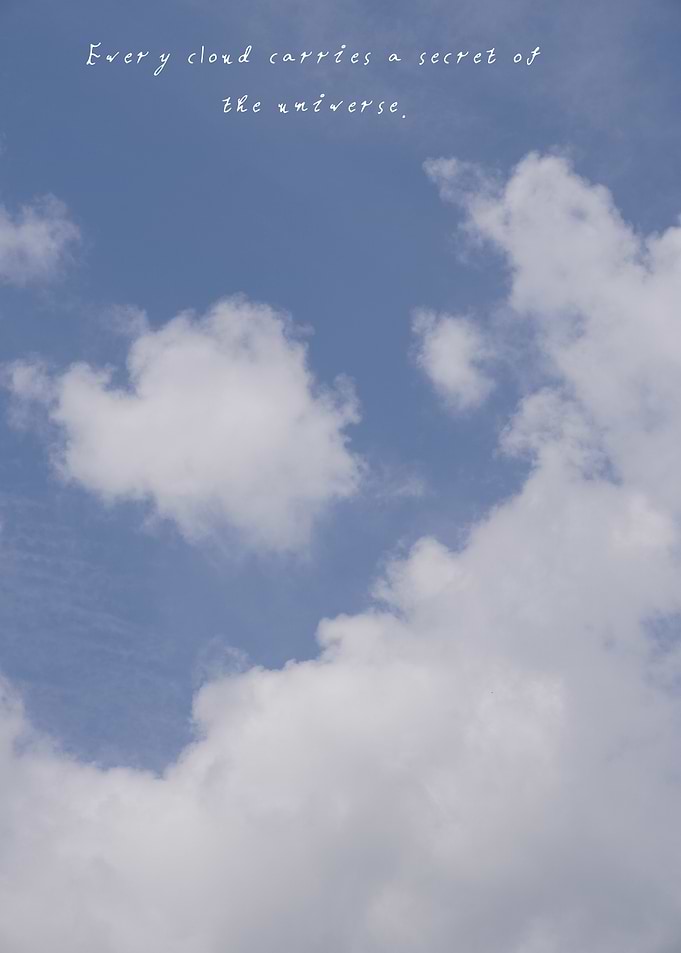 Delicate clouds drift gently under a clear sky, reminding us that every shape hides a hidden mystery.