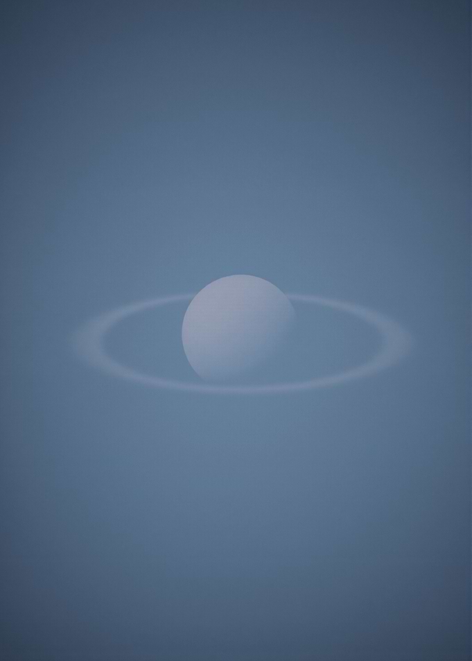 Saturn-like planet with rings in space