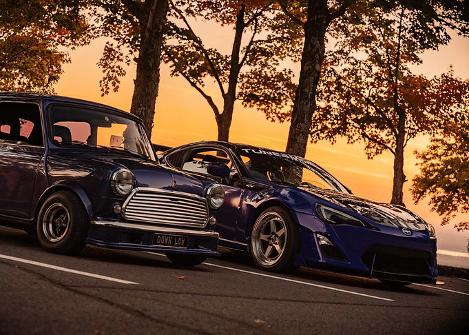 Two Blue Cars at Sunset
