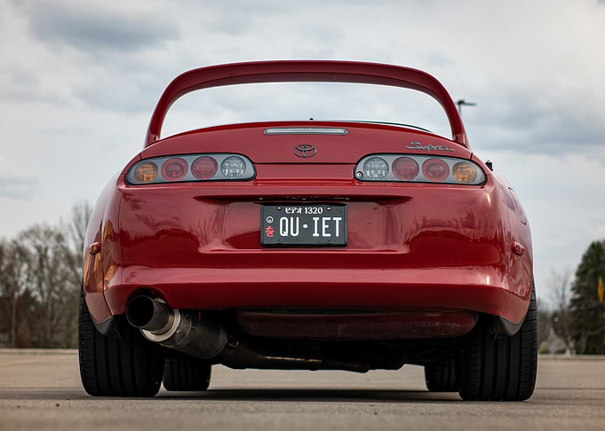 Red A80 mark4 Toyota Supra Rear View quiet plate