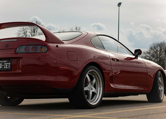 Red mark4 a80 Toyota Supra parked outdoors Quiet plate