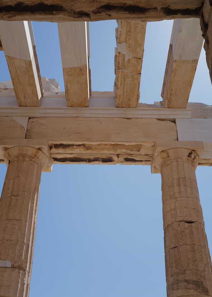 Parthenon Columns Against Blue Sky