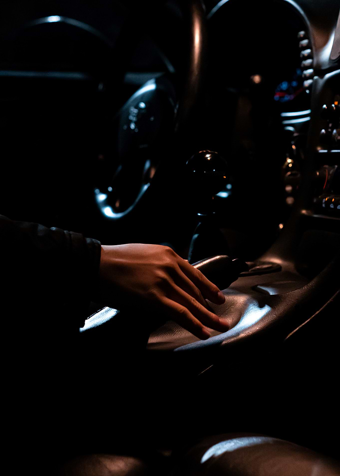 Hand on car console at night C5 corvette manual