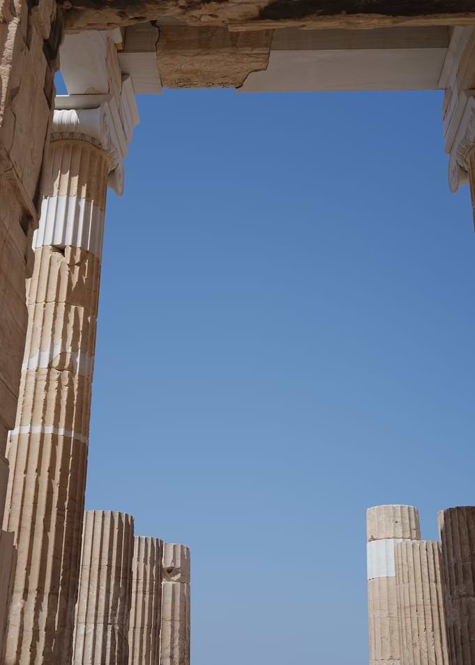 Ancient Columns Framing Blue Sky