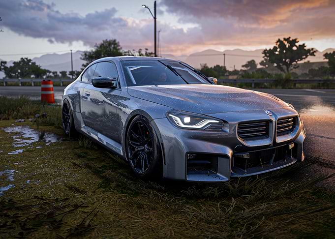 Silver BMW M2 on Wet Road