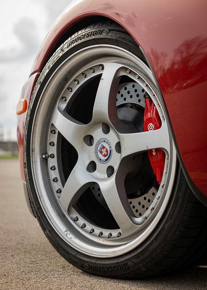 Red Toyota Supra mark4 a80 Car Wheel Close-Up