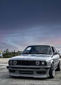 Gray BMW E30 on a Road