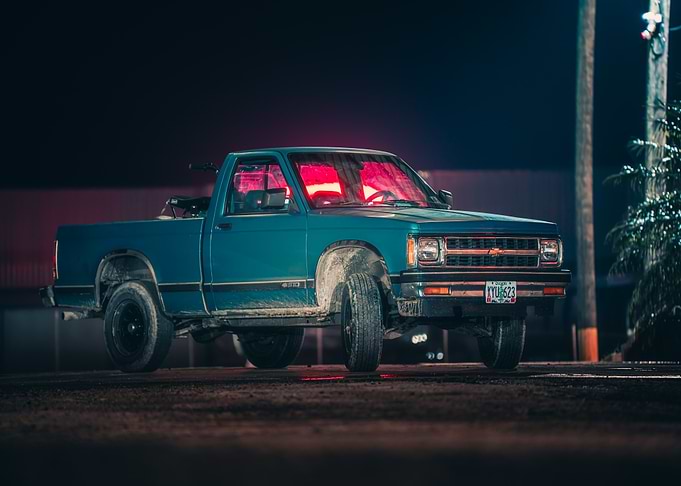 Blue Chevrolet Pickup Truck at Night