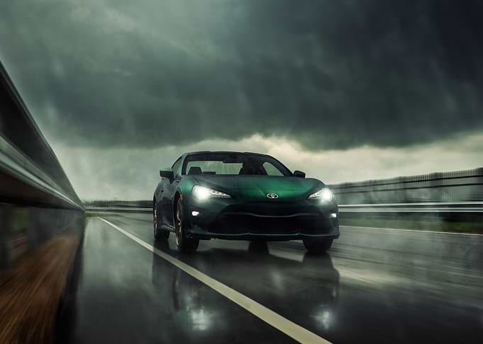 Green Toyota 86 on Rainy Road