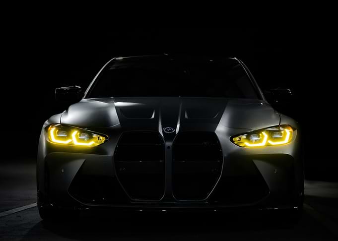 Sleek Gray BMW with Yellow Headlights