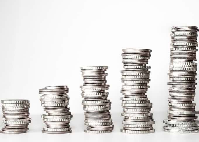 Stacks of Coins on White Background