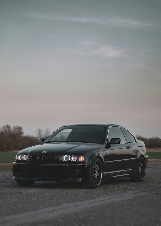 Black BMW Coupe on Asphalt Road
