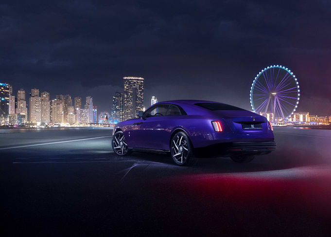 Purple Rolls Royce at Night Cityscape