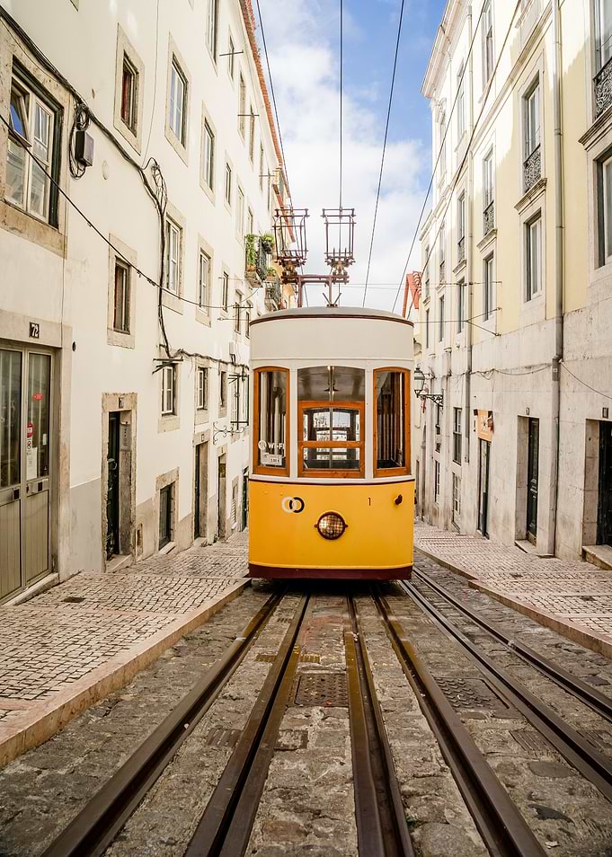 Lisbon Tram Ascending Cobblestone Street