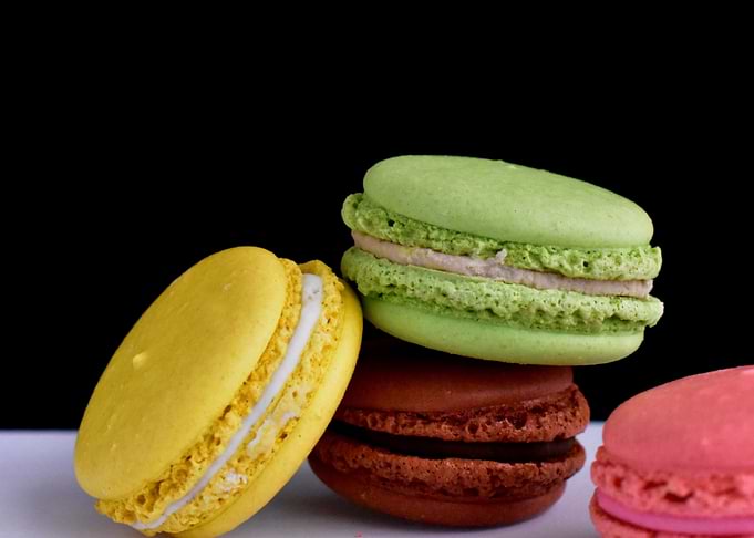 Colorful Macarons on White Surface
