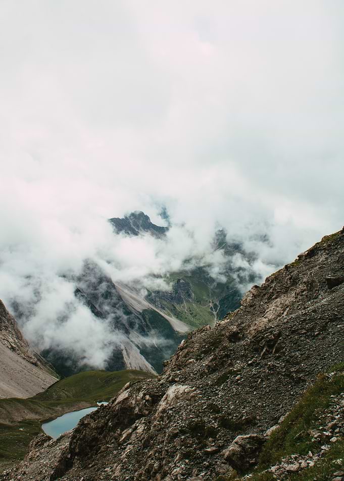 Mountainous Landscape with Clouds and Lake