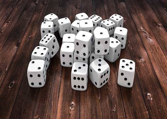 Pile of White Dice on Wood