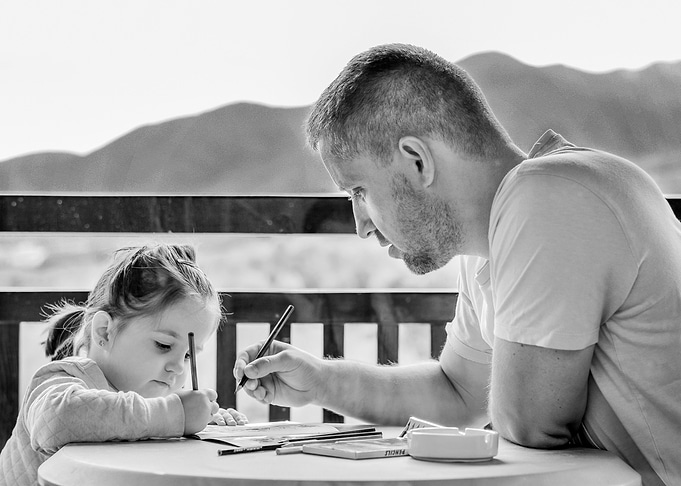 Father and Daughter Drawing Together