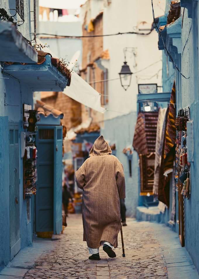 Man in Djellaba Walking in Chefchaoun